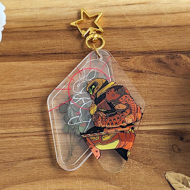 Acrylic charm with dried flowers inside. Design based on DOOM Eternal.